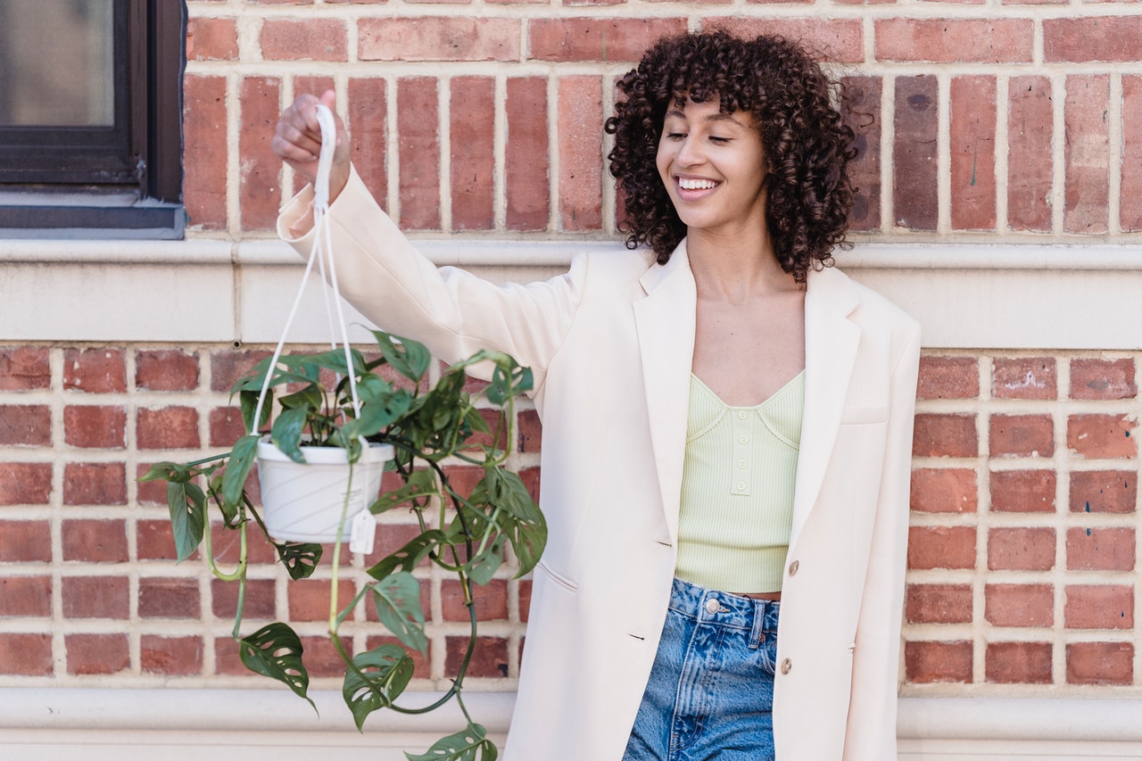 woman with hanging plant