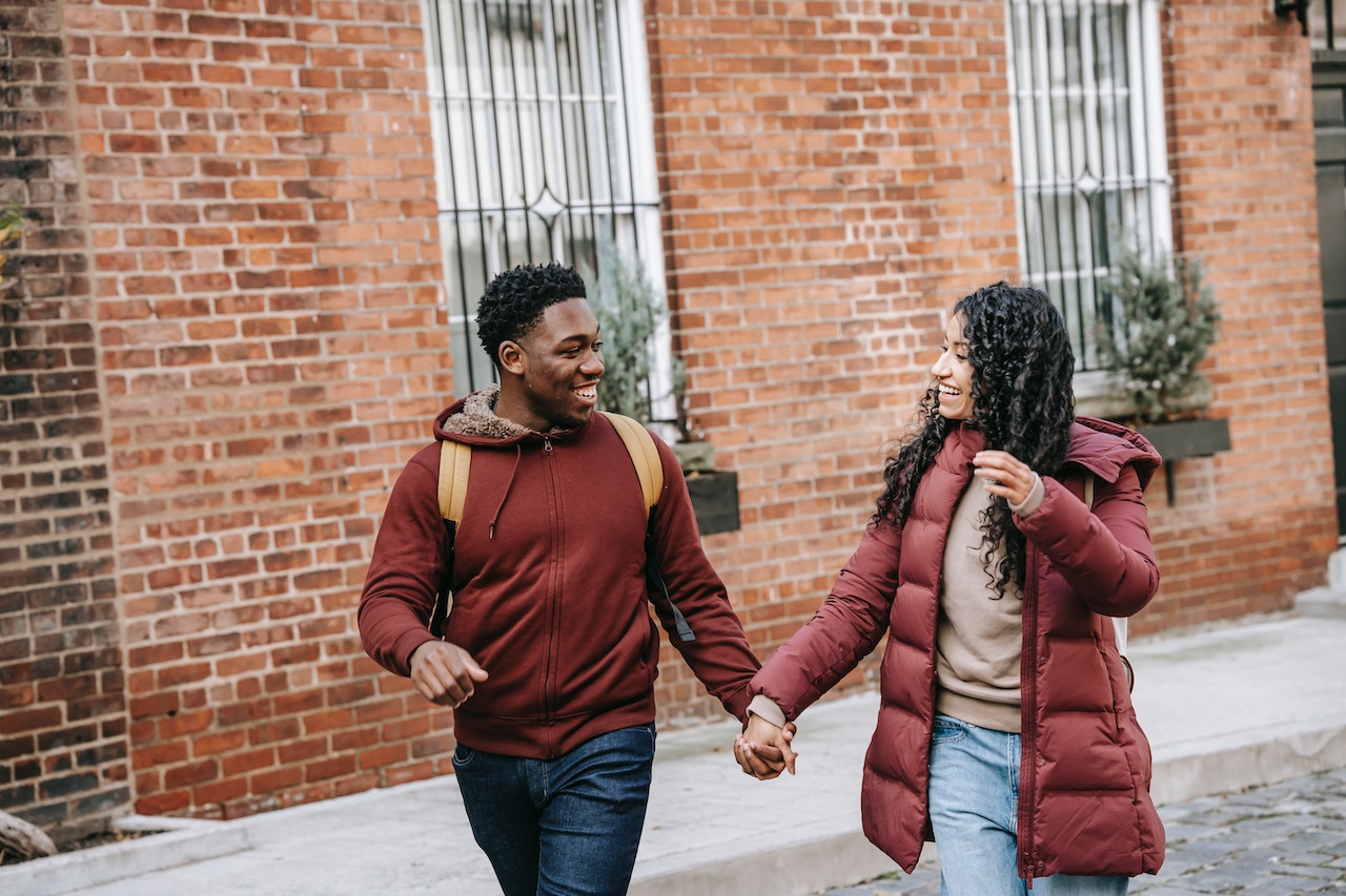 Young couple holding hands and appreciating each other