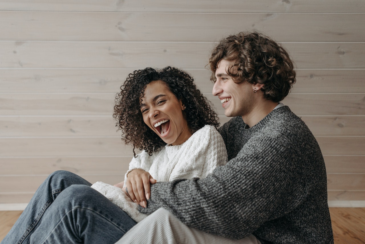 man and woman laughing