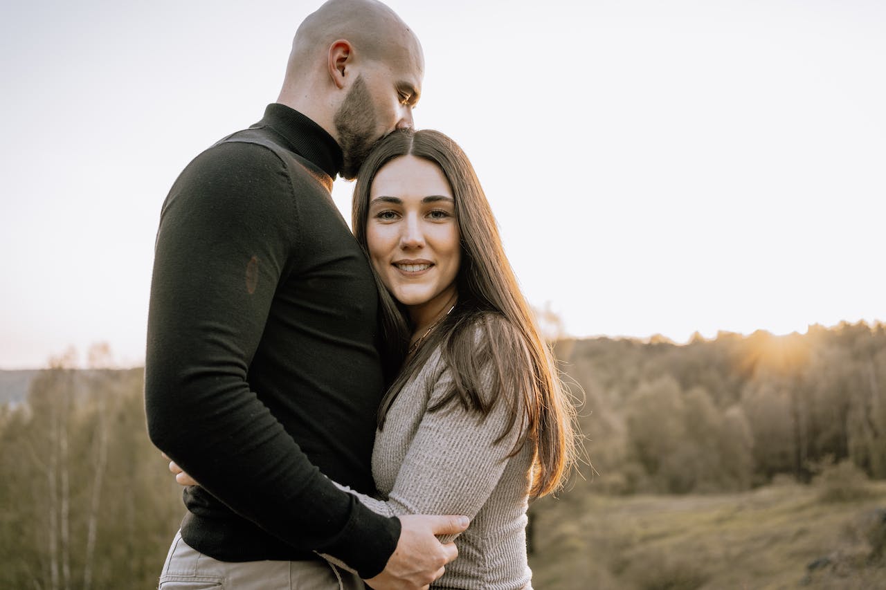 man and woman hugging