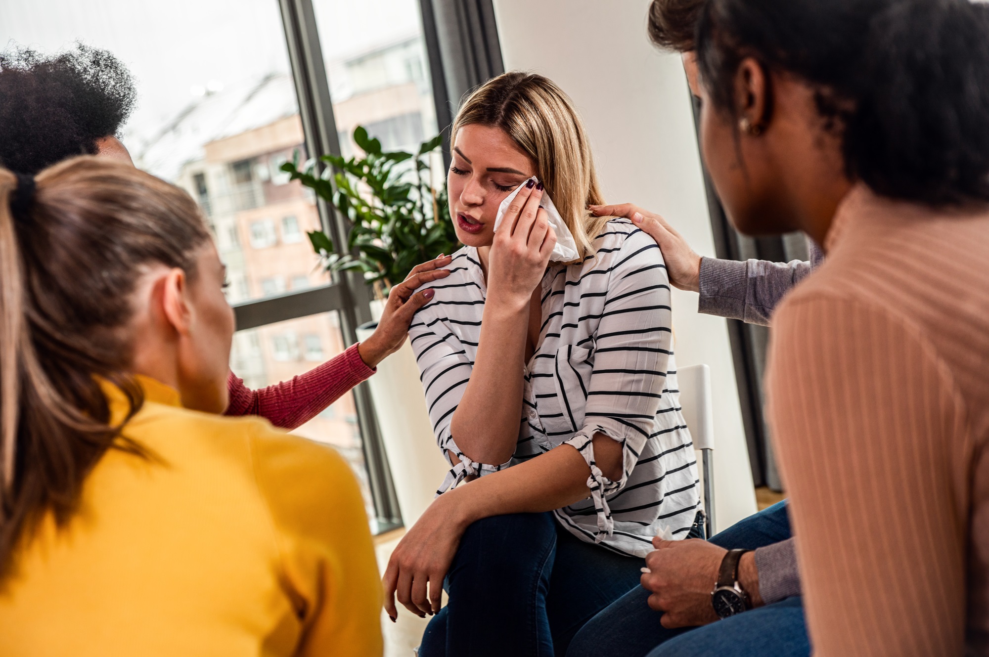 woman crying in a support group