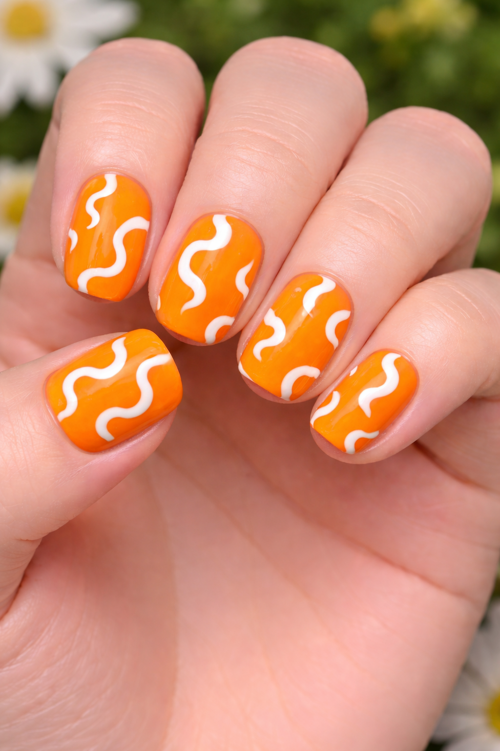 cute spring nails - Vibrant orange with white squiggles