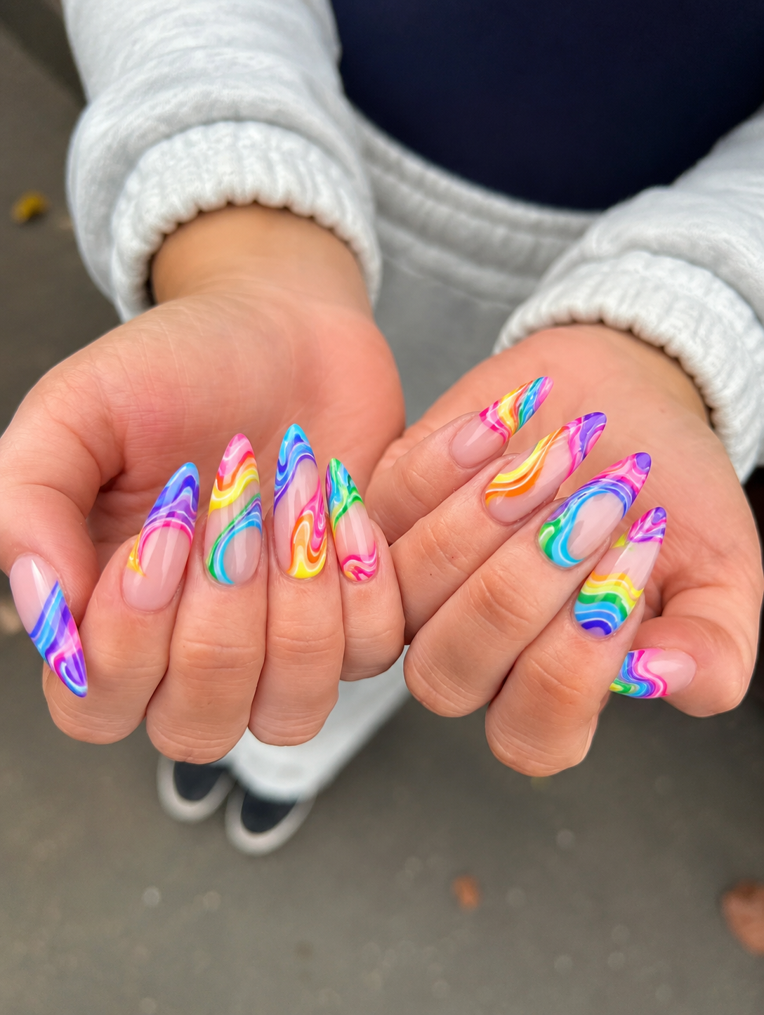 swirly rainbow whimsical nail desgin