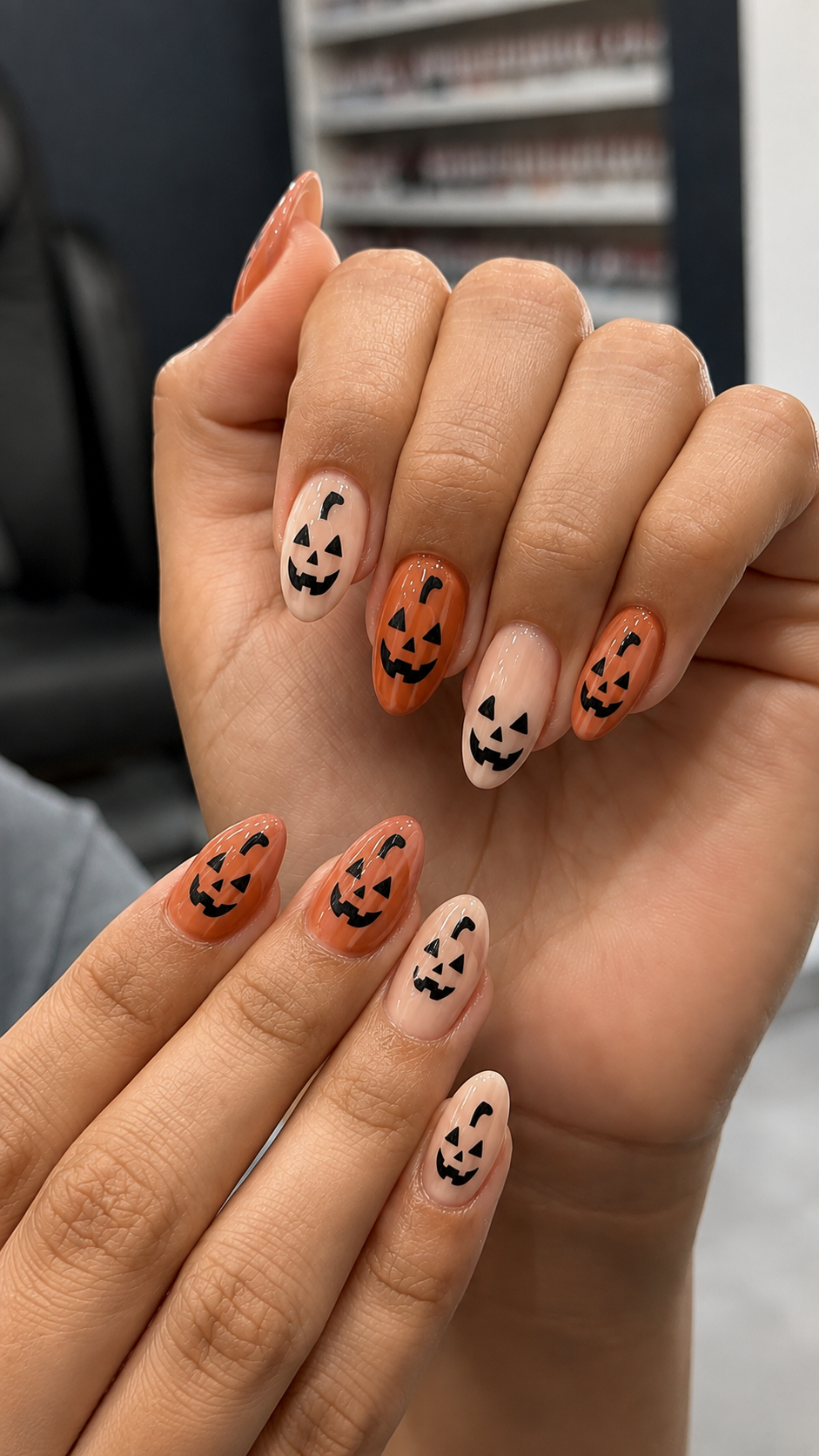 Pumpkin nail ideas for halloween with spooky face