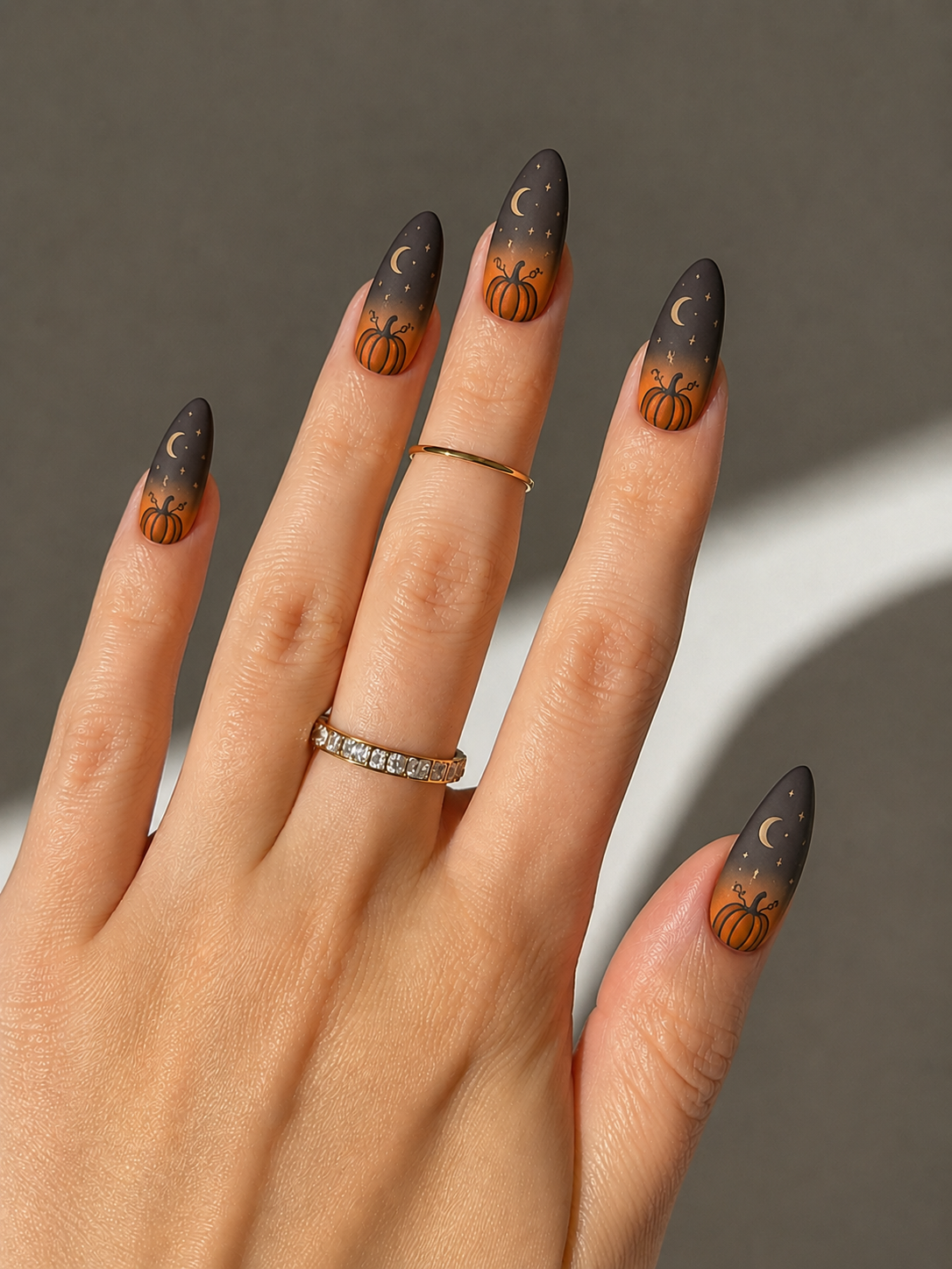 pumpkin nail ideas for halloween with moon design